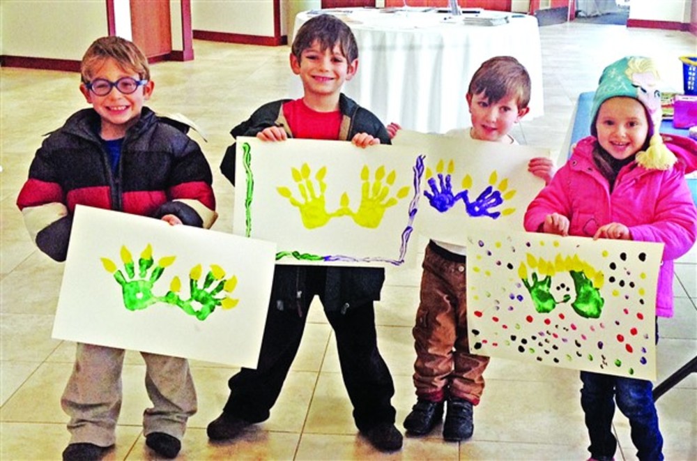Preschoolers show off their projects at Temple Torat Yisrael.
